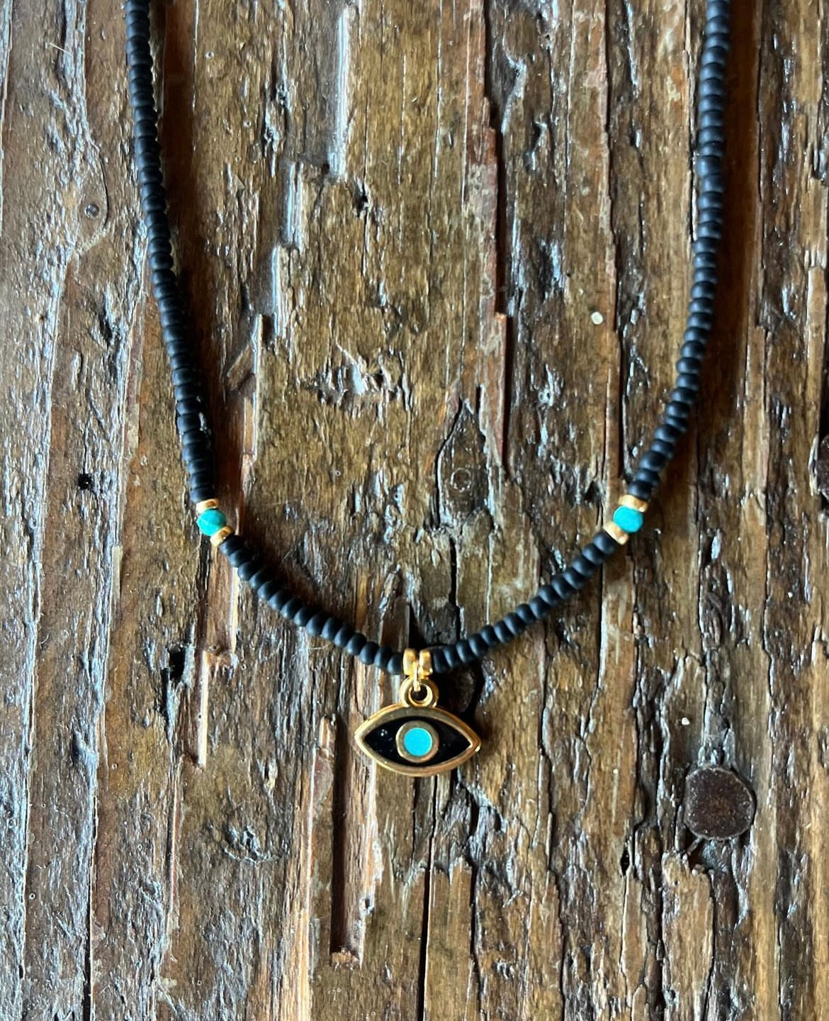 Enamel evil eye and seed bead necklace with turquoise.