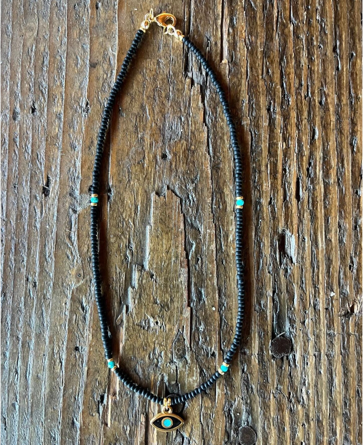 Enamel evil eye and seed bead necklace with turquoise.